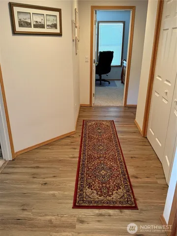 a view of bedroom with wooden floor