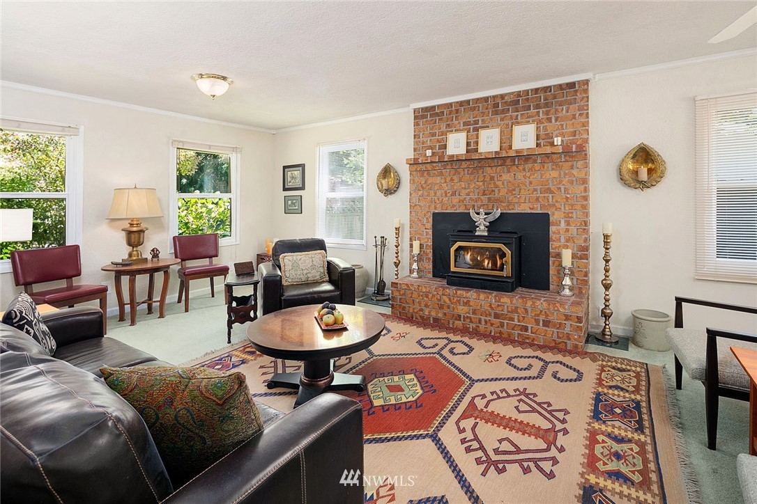 17905 Beall Road Southwest Vashon, WA 98070 - Photo 2 of 20 a living room with furniture and a fireplace