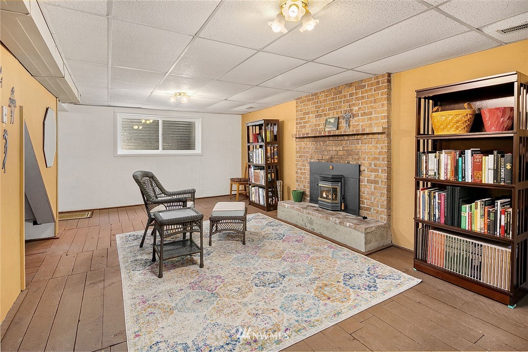 17905 Beall Road Southwest Vashon, WA 98070 - Photo 14 of 20 a living room with furniture and a fireplace