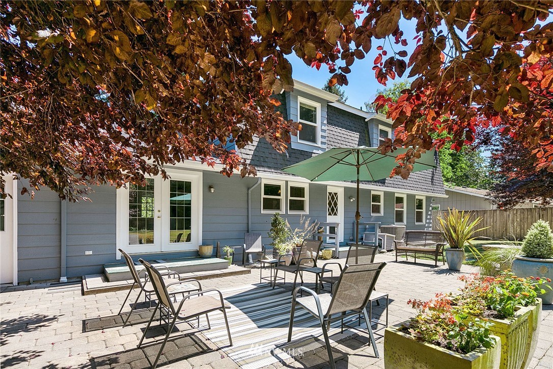 17905 Beall Road Southwest Vashon, WA 98070 - Photo 17 of 20 a view of a patio with table and chairs and potted plants