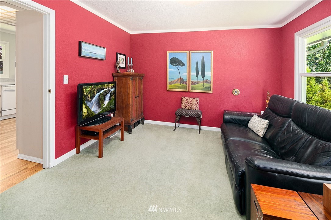 17905 Beall Road Southwest Vashon, WA 98070 - Photo 4 of 20 a living room with furniture and a flat screen tv