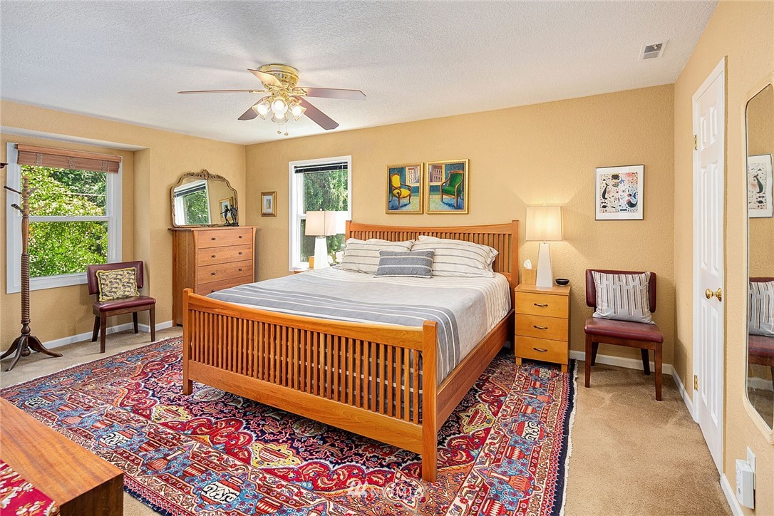 17905 Beall Road Southwest Vashon, WA 98070 - Photo 9 of 20 a bedroom with a bed and a window