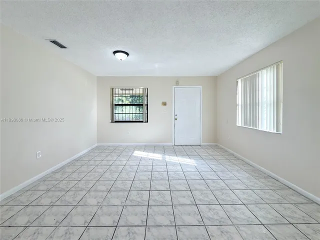 a view of an empty room and window