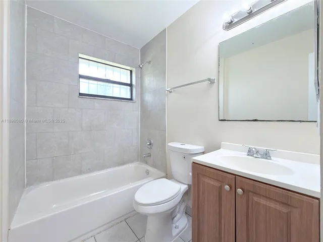 a bathroom with a sink toilet and bathtub
