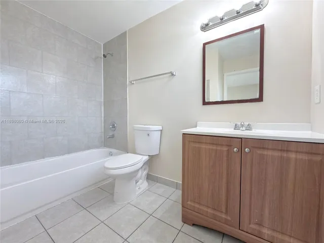 a bathroom with a toilet a sink and bathtub