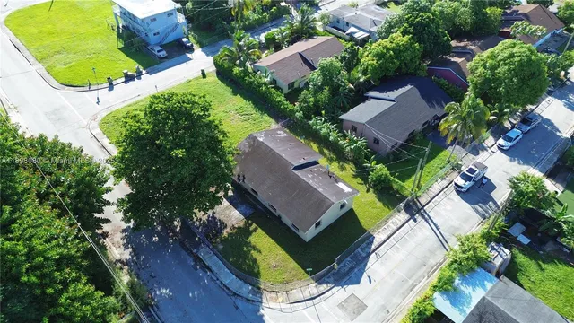 an aerial view of a house with a garden