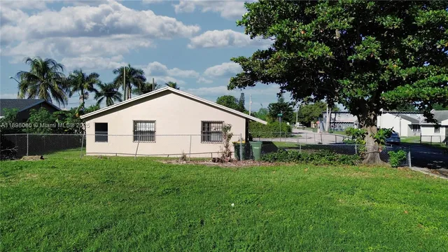 a backyard of a house with lots of green space