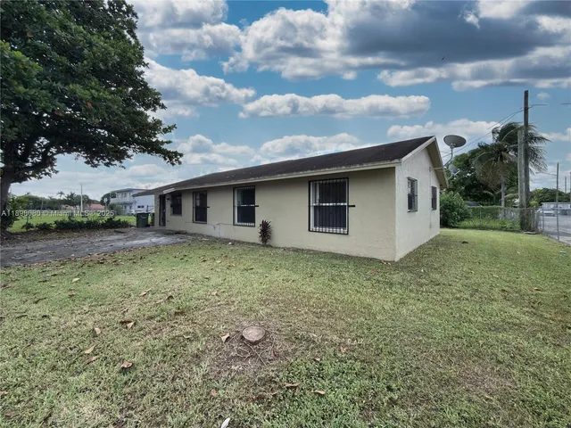 a backyard of a house with lots of green space