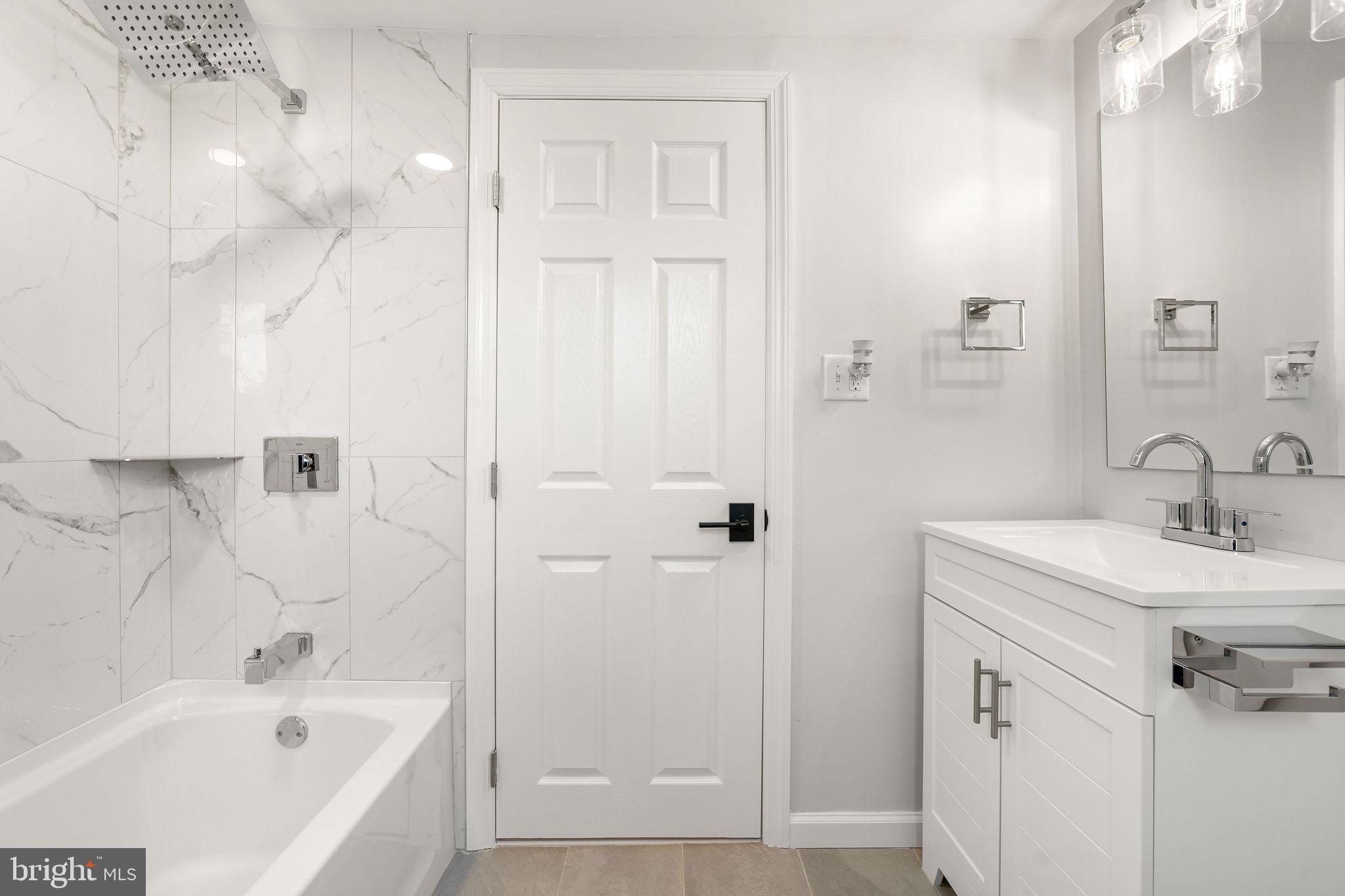 4 Walnut Street Salem, NJ 08079 - Photo 13 of 33 a bathroom with a bathtub and a sink