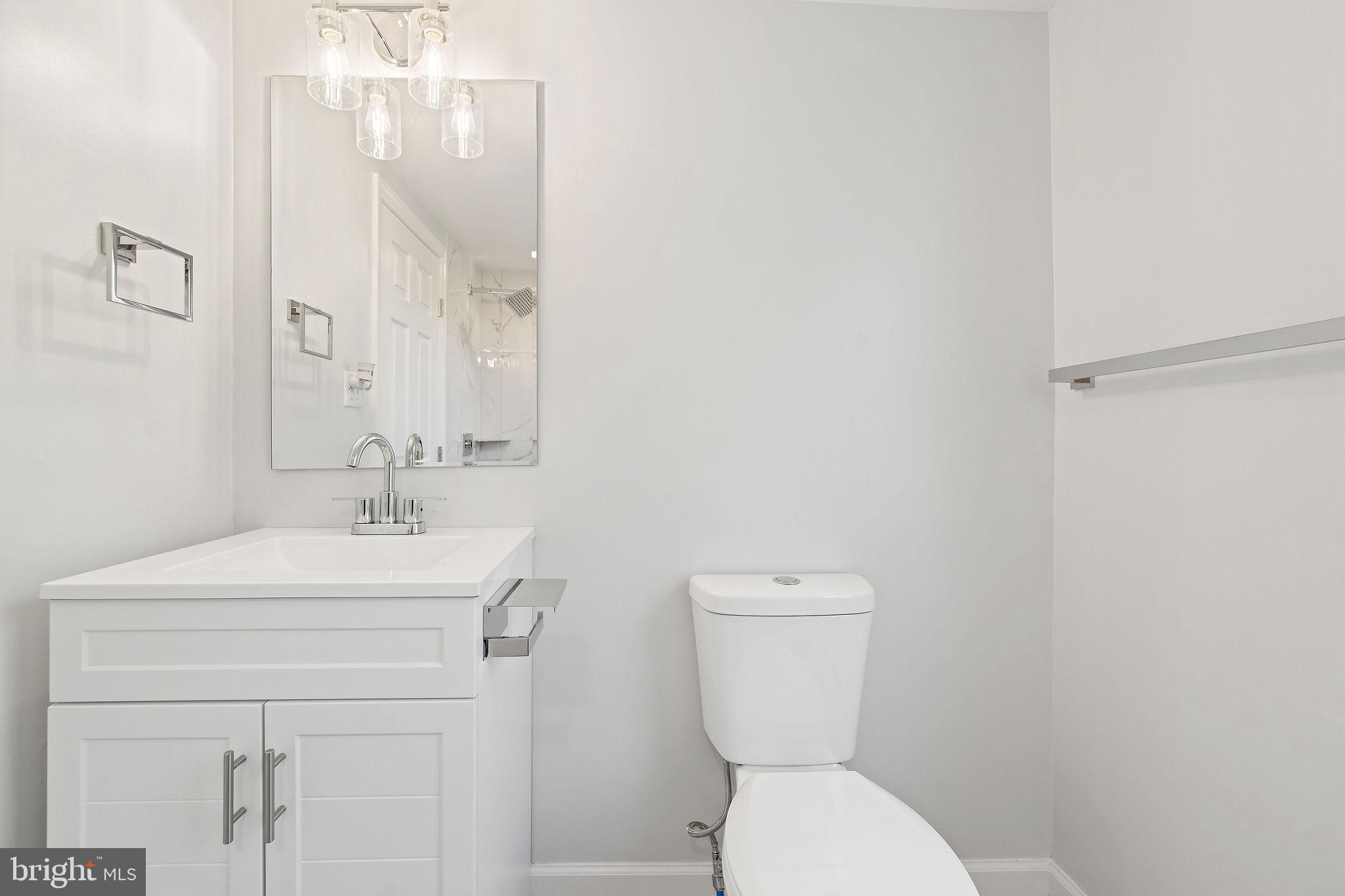 4 Walnut Street Salem, NJ 08079 - Photo 14 of 33 a bathroom with a toilet sink and mirror
