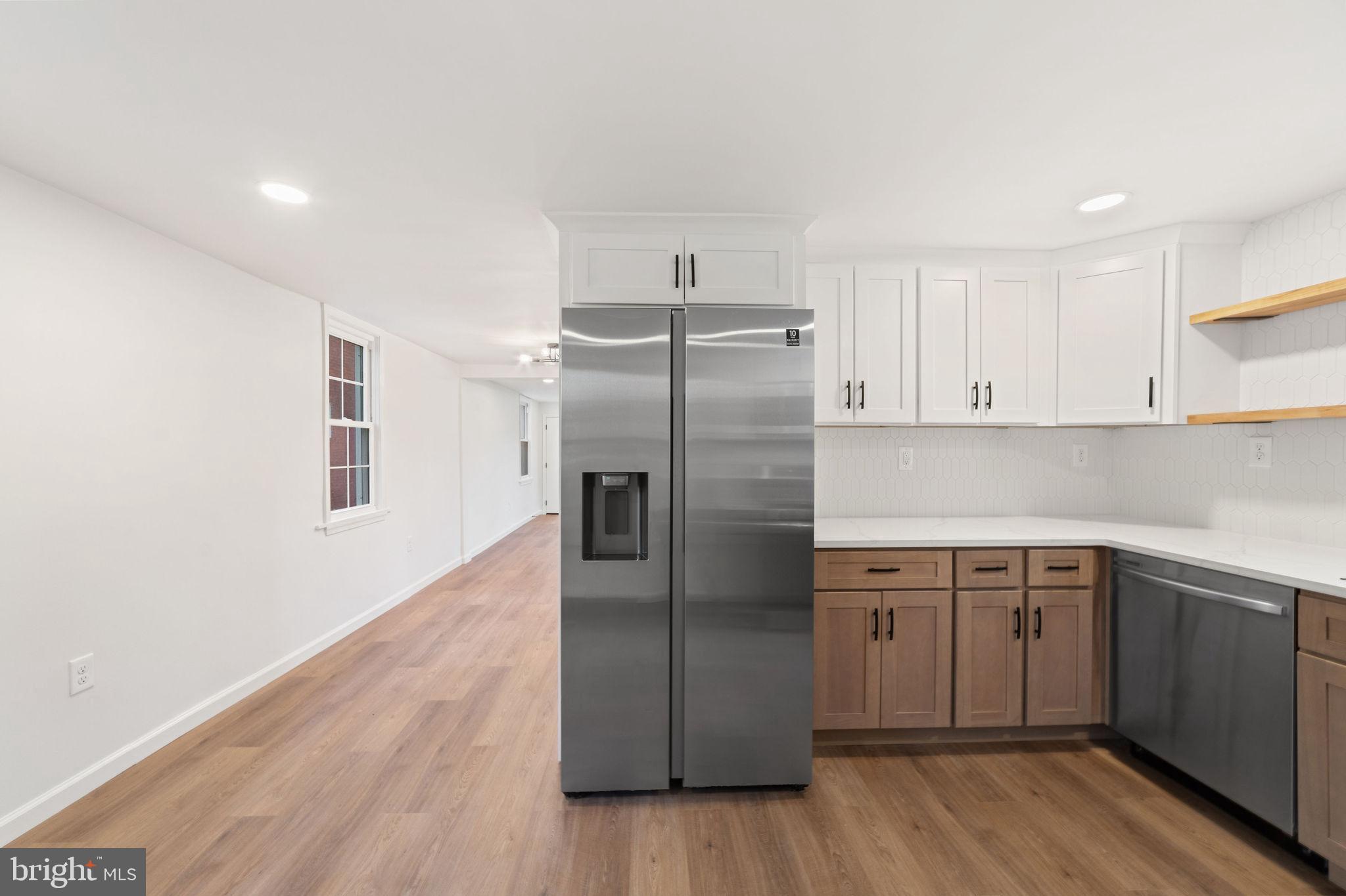 4 Walnut Street Salem, NJ 08079 - Photo 7 of 33 a kitchen with a sink refrigerator and microwave