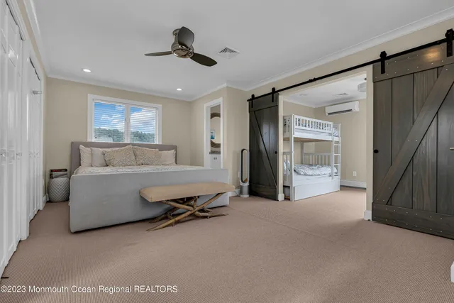 a living room with furniture and a ceiling fan