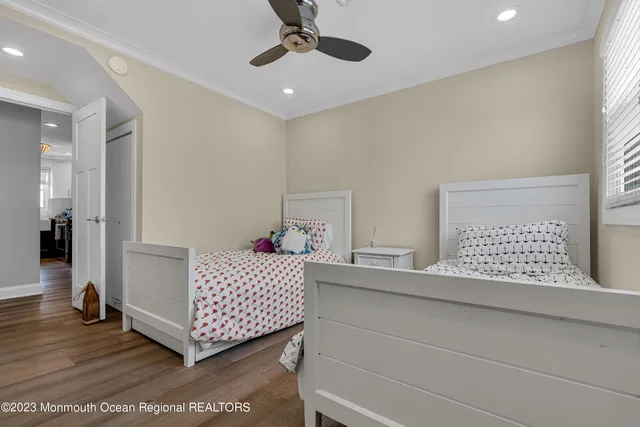 a bathroom with a toilet sink vanity and mirror