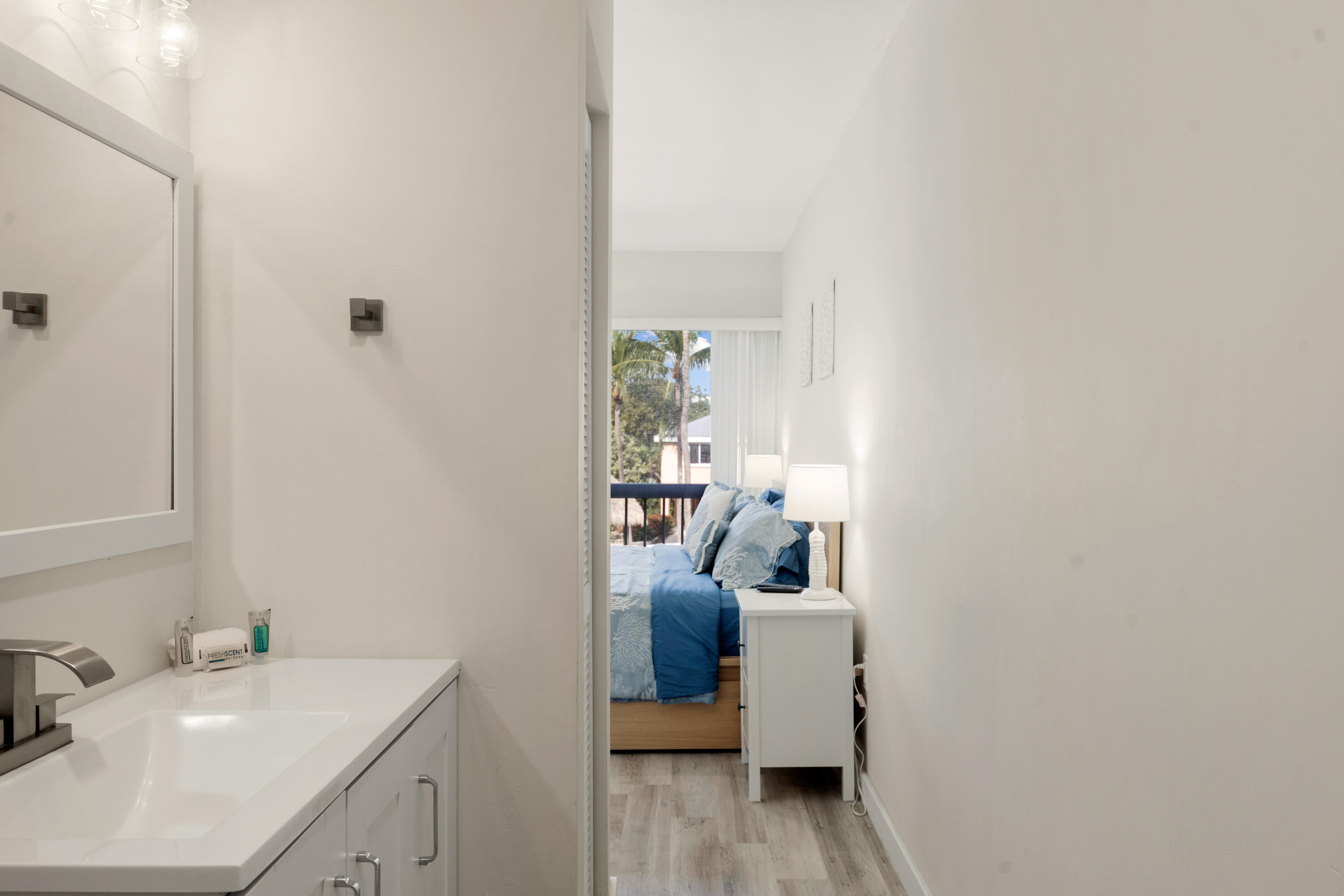 98302 Windward Avenue Key Largo, FL 33037 - Photo 12 of 35 a bathroom with a sink toilet and a mirror