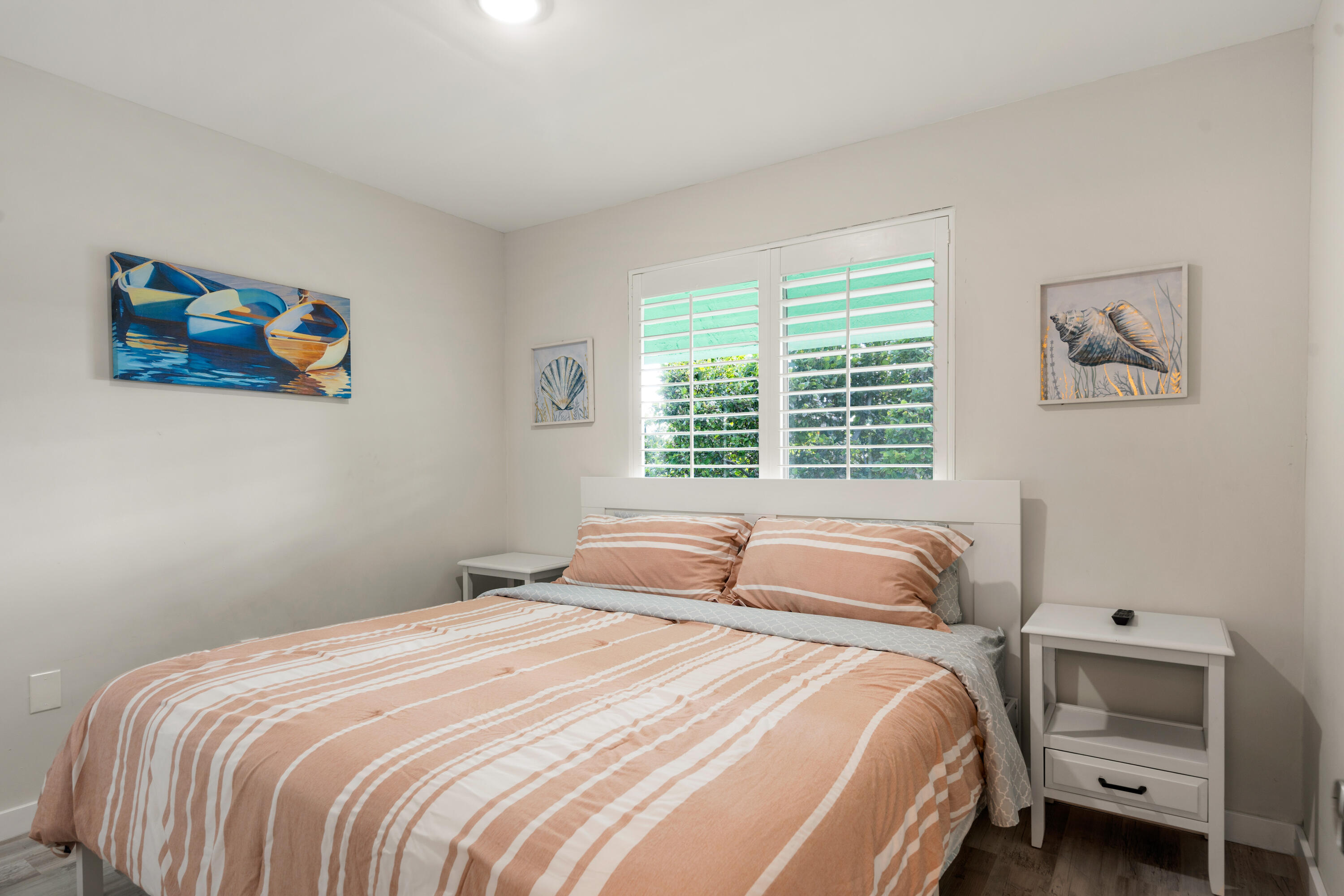 98302 Windward Avenue Key Largo, FL 33037 - Photo 13 of 35 a bedroom with a bed and a window