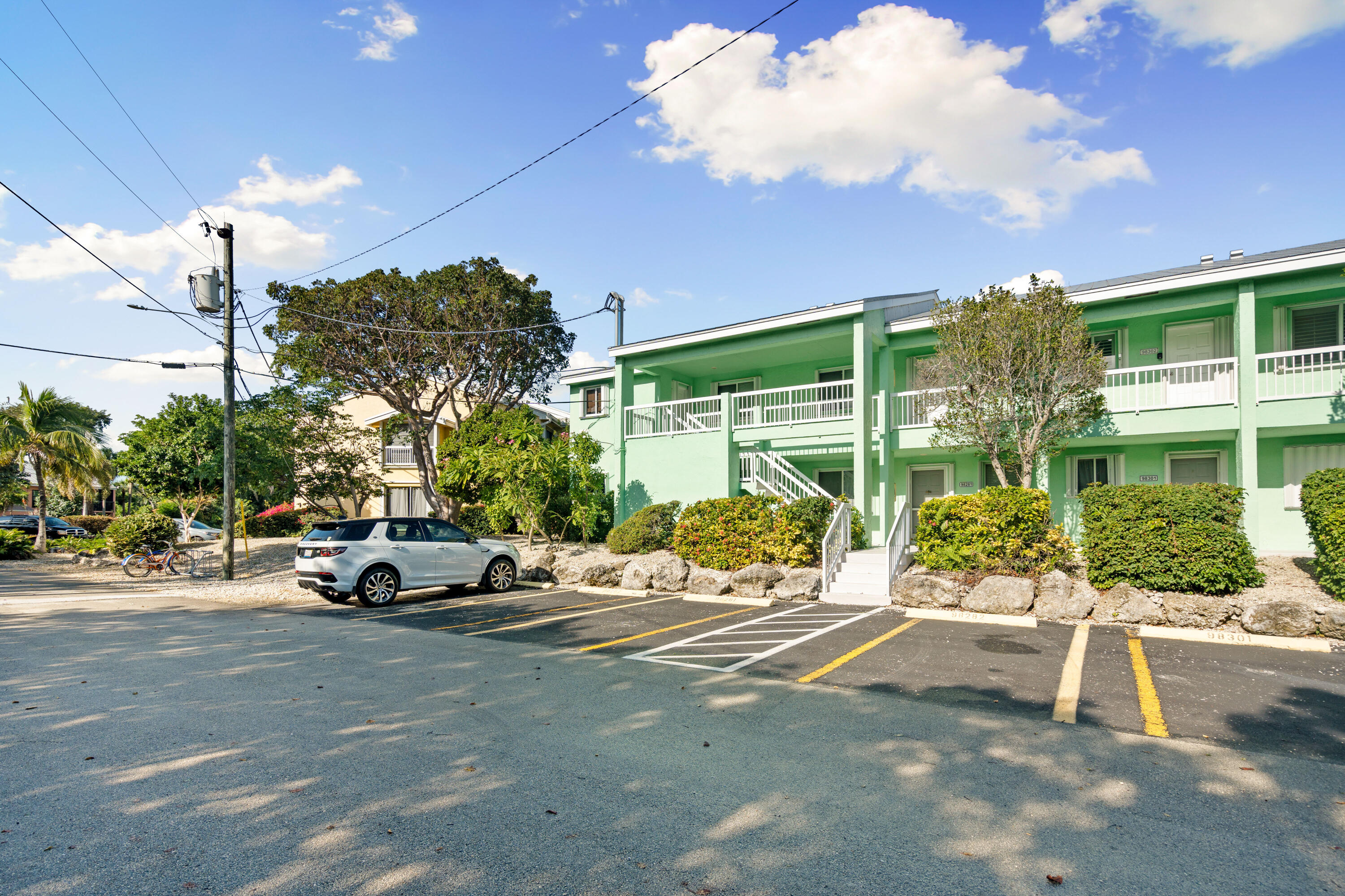 98302 Windward Avenue Key Largo, FL 33037 - Photo 17 of 35 a car parked in front of a building