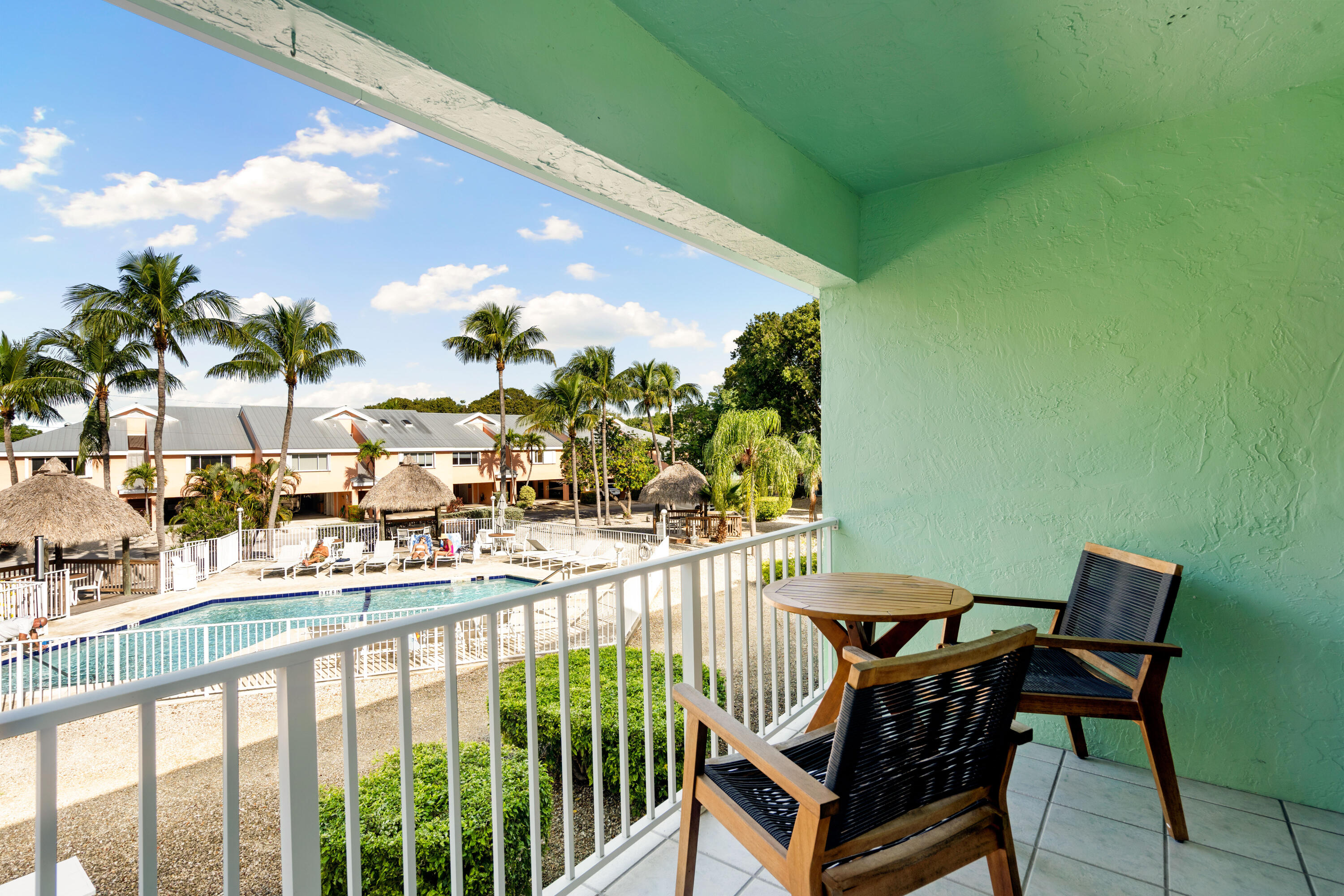 98302 Windward Avenue Key Largo, FL 33037 - Photo 2 of 35 a view of a chairs and table in patio