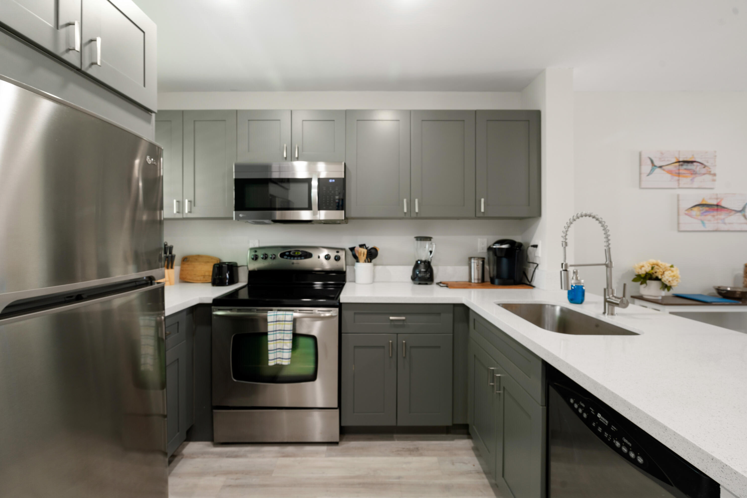98302 Windward Avenue Key Largo, FL 33037 - Photo 7 of 35 a kitchen with a sink and steel appliances
