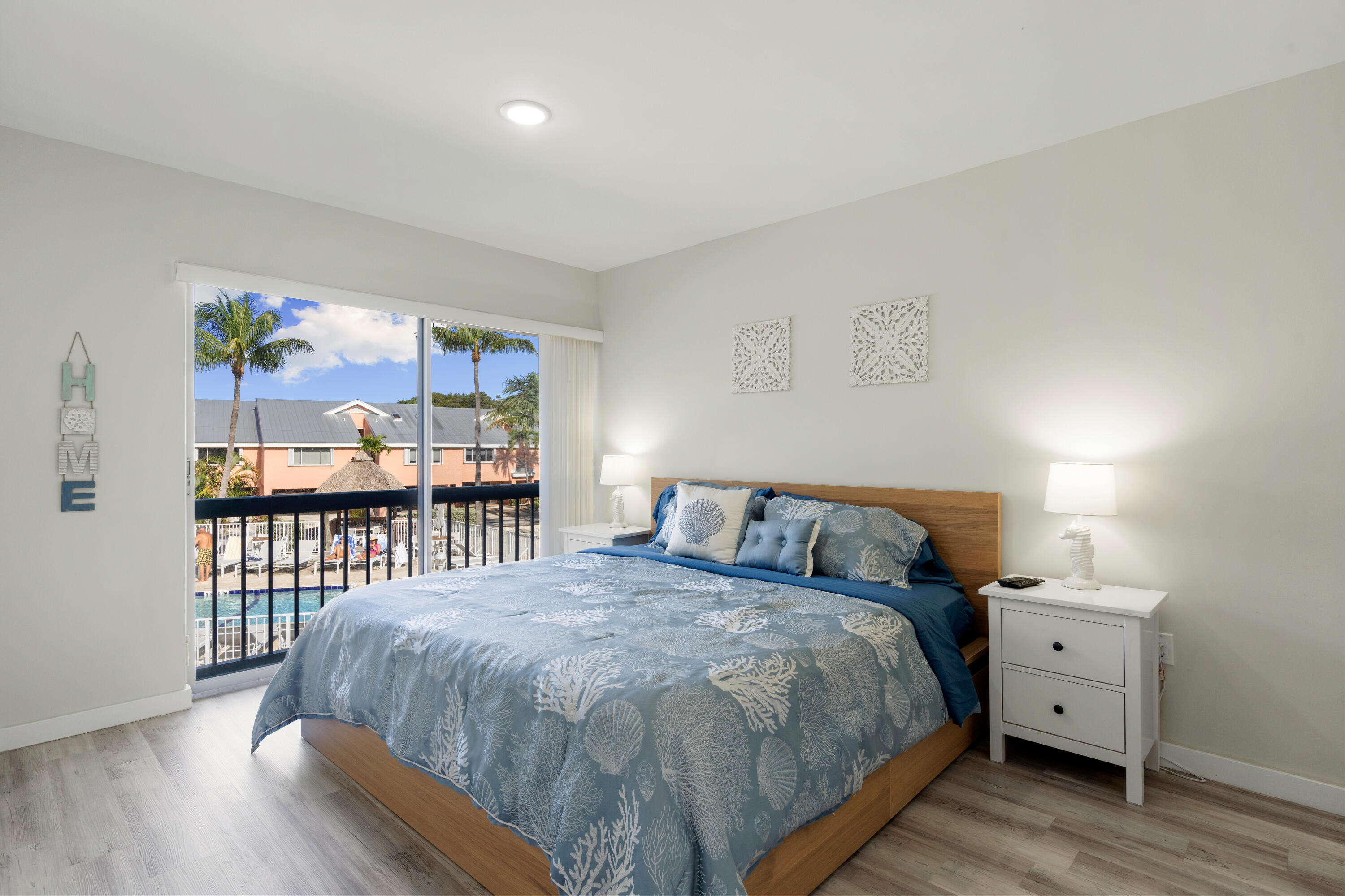 98302 Windward Avenue Key Largo, FL 33037 - Photo 9 of 35 a bed sitting in a bedroom next to a window