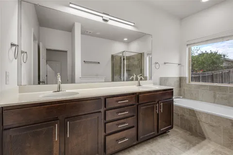 a bathroom with a sink and a large mirror