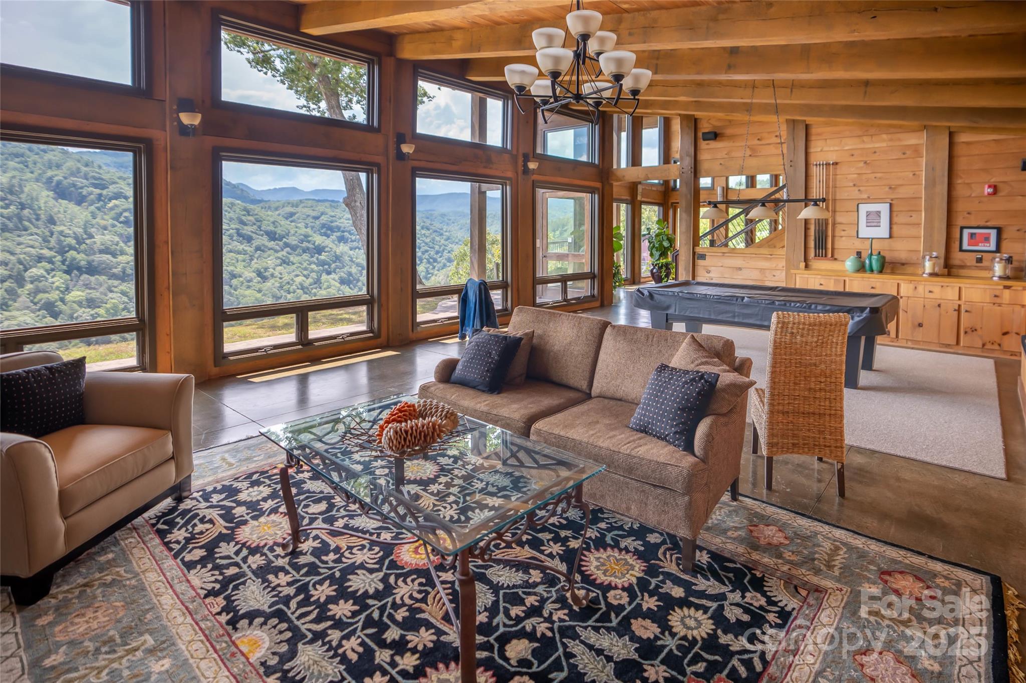 101 Red Maple Run, Unit 1 Marshall, NC 28753 - Photo 19 of 45 a living room with furniture and a floor to ceiling window