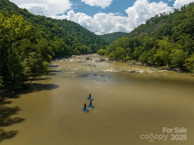 a view of a lake with a building in the background