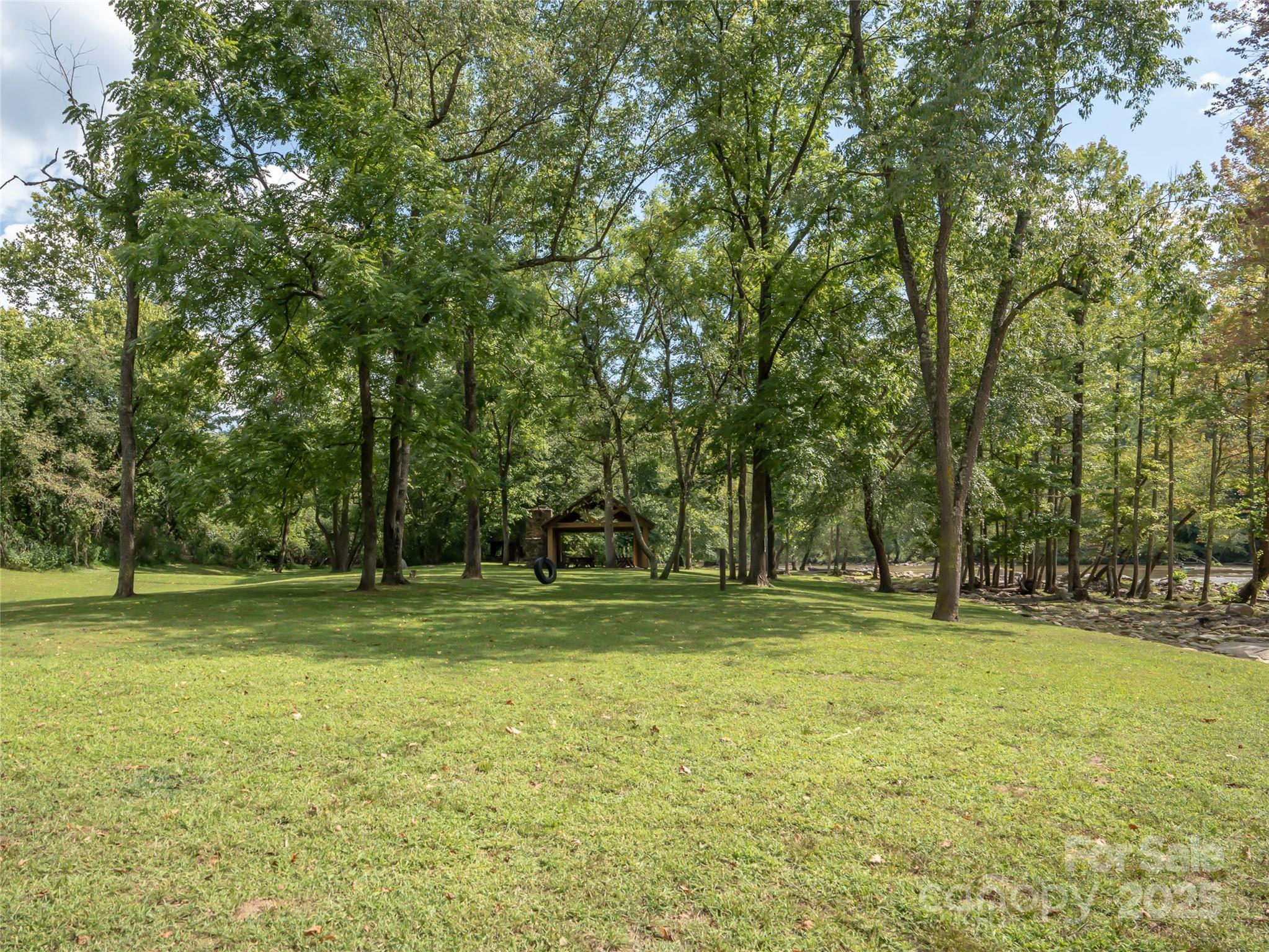 101 Red Maple Run, Unit 1 Marshall, NC 28753 - Photo 31 of 45 a yard with trees in the background