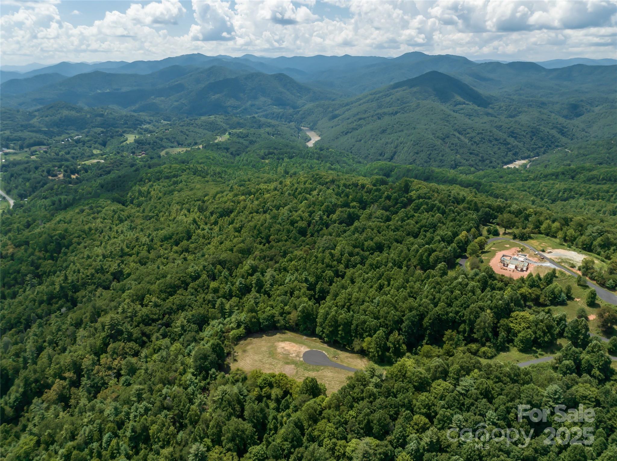 101 Red Maple Run, Unit 1 Marshall, NC 28753 - Photo 37 of 45 a view of a mountain in the distance in a field