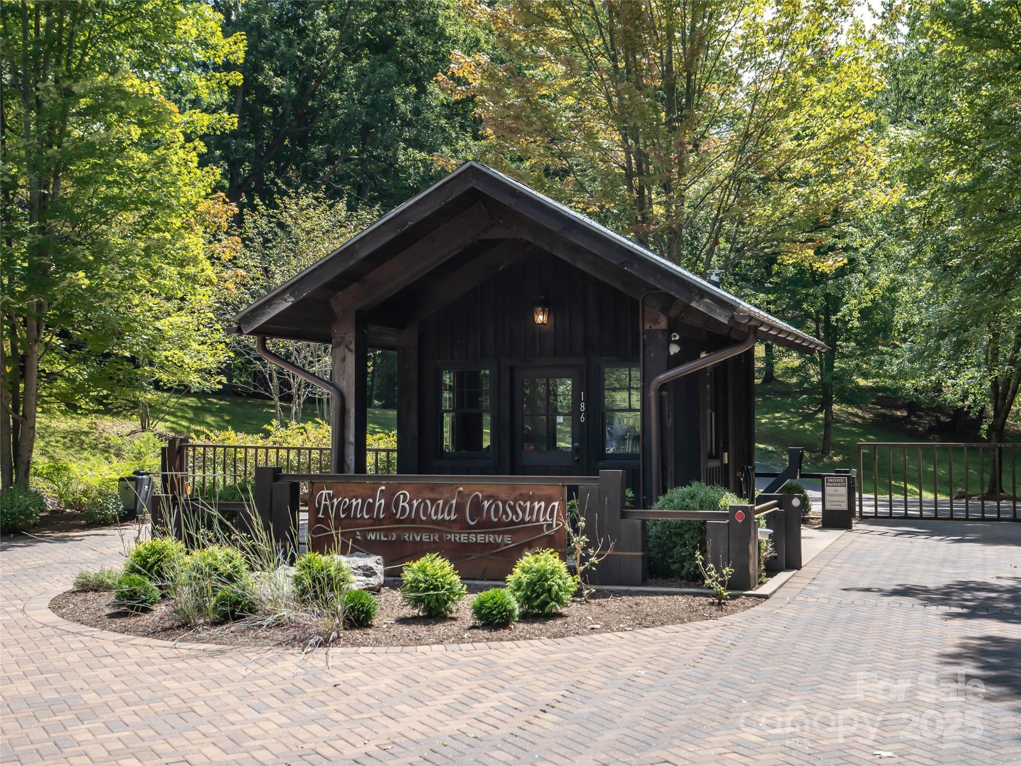 101 Red Maple Run, Unit 1 Marshall, NC 28753 - Photo 6 of 45 a view of a house with a small yard plants and a large tree