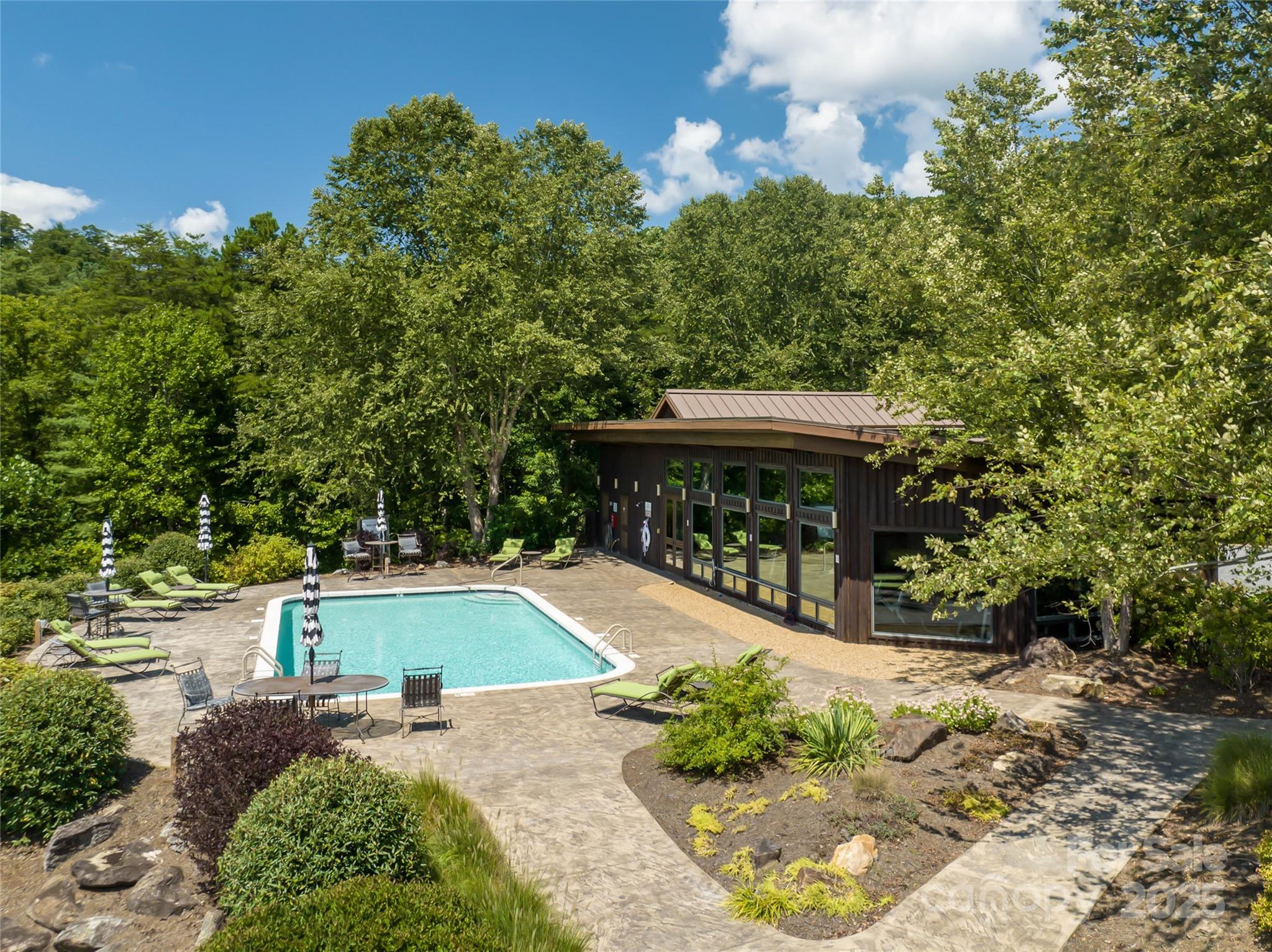 101 Red Maple Run, Unit 1 Marshall, NC 28753 - Photo 10 of 45 a view of a swimming pool with an outdoor seating area