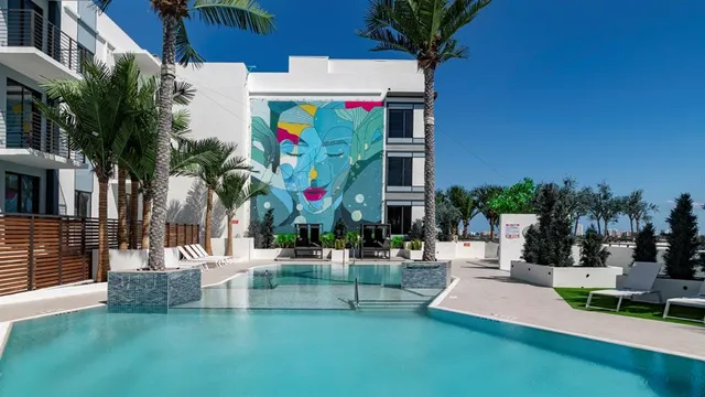 a view of a swimming pool with a lounge chairs