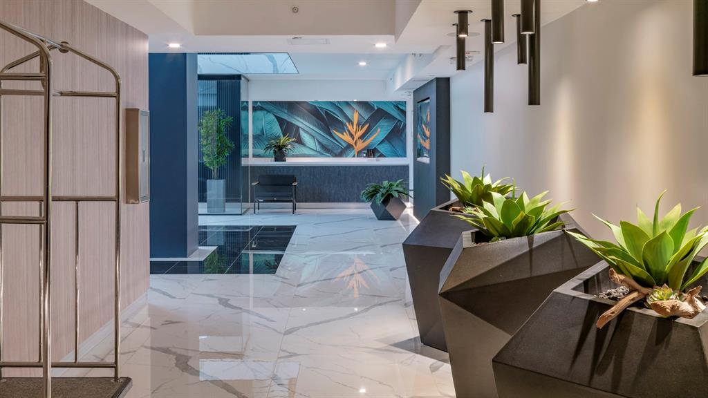 425-475 East Atlantic Boulevard, Unit 510 Pompano Beach, FL 33060 - Photo 31 of 35 a lobby with furniture and a potted plant