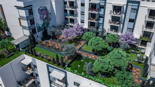 a view of a house with backyard sitting area and garden
