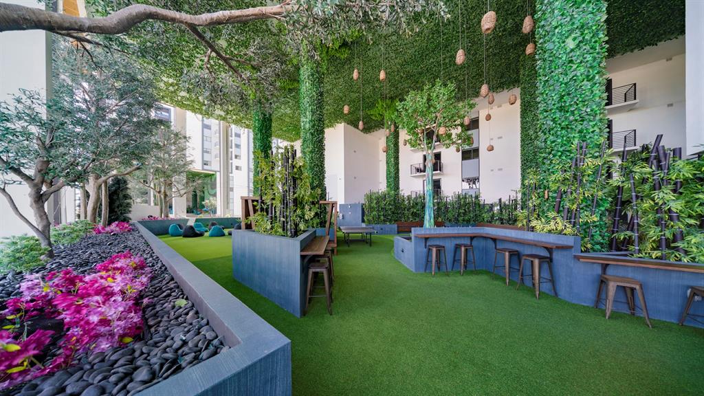 425-475 East Atlantic Boulevard, Unit 510 Pompano Beach, FL 33060 - Photo 10 of 35 a view of a house with backyard sitting area and garden