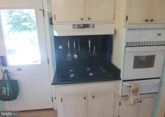 a bathroom with a sink a mirror and a shower