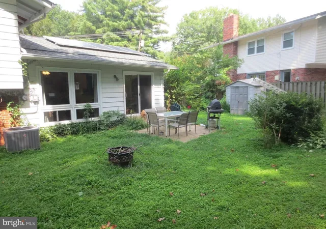 a backyard of a house with seating space
