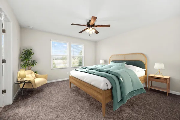 a bedroom with a bed and window