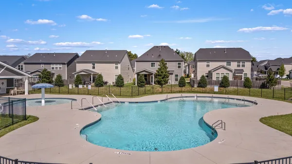 a view of a house with swimming pool