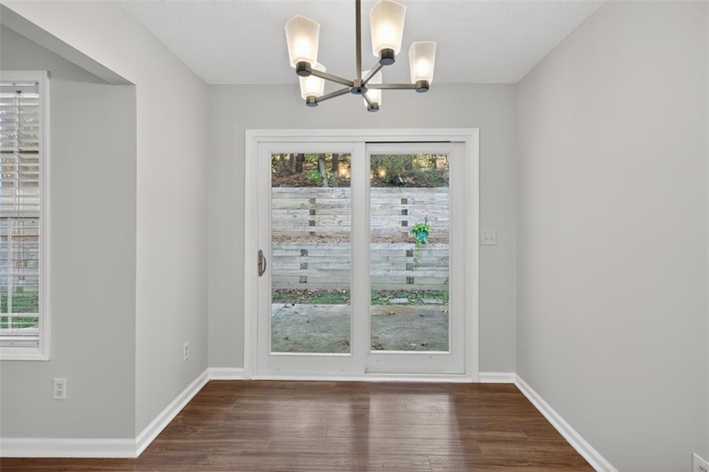5683 Riverside Walk Drive Northeast Sugar Hill, GA 30518 - Photo 14 of 42 a view of a livingroom with wooden floor and a window