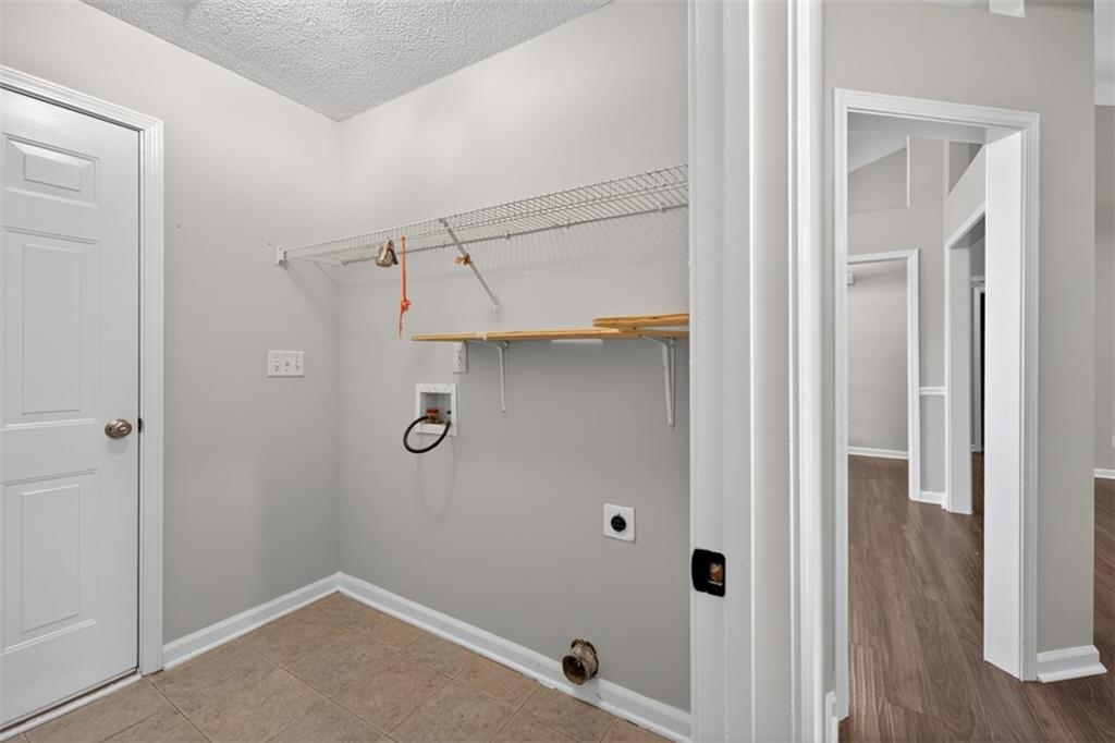 5683 Riverside Walk Drive Northeast Sugar Hill, GA 30518 - Photo 26 of 42 a bathroom with a shower