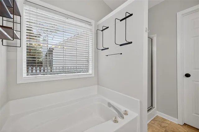 a en suite bathroom with a sink double vanity and a mirror