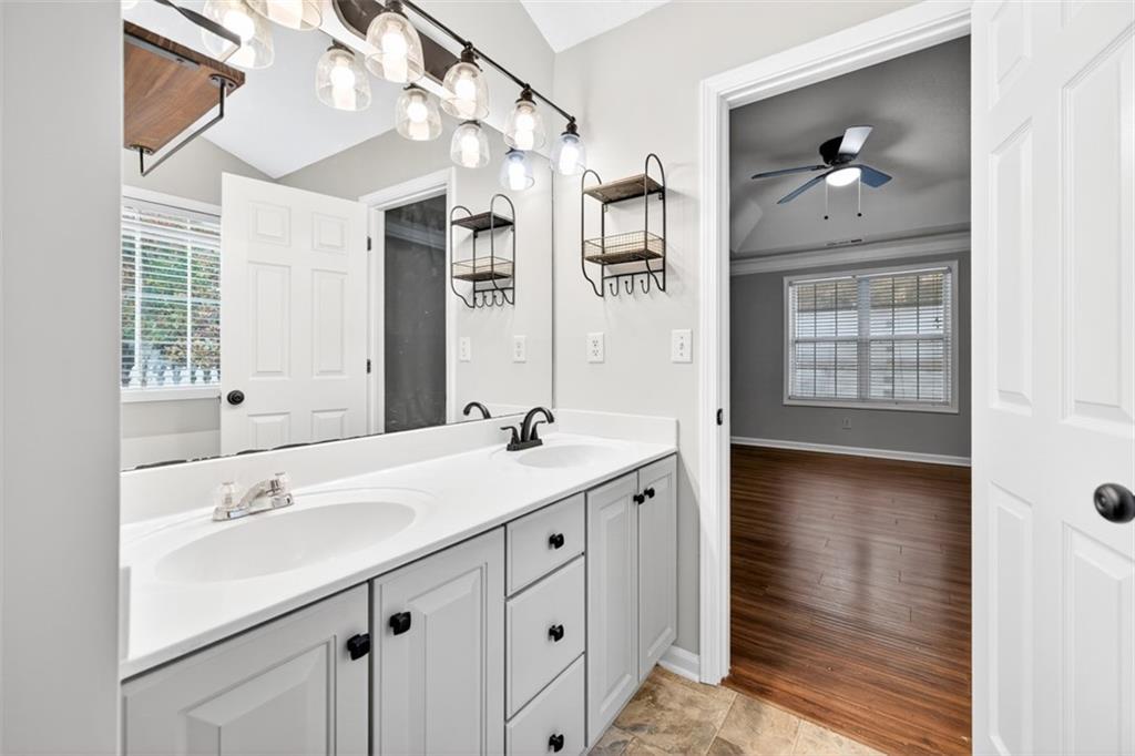 5683 Riverside Walk Drive Northeast Sugar Hill, GA 30518 - Photo 34 of 42 a en suite bathroom with a sink double vanity and a mirror
