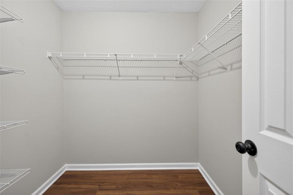 5683 Riverside Walk Drive Northeast Sugar Hill, GA 30518 - Photo 35 of 42 a view of a room with racks on the wall