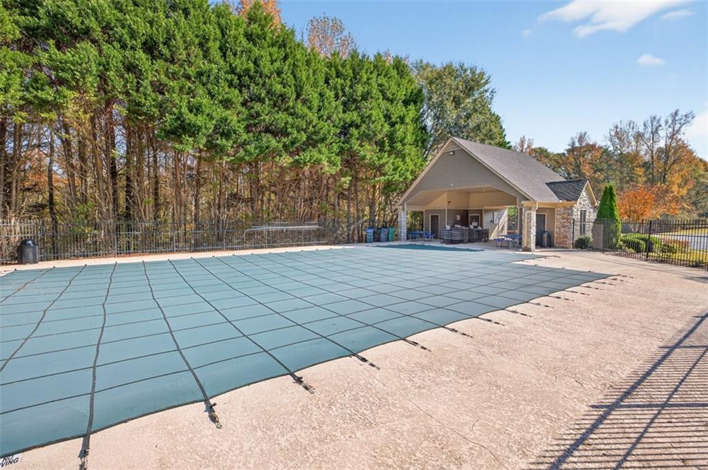 5683 Riverside Walk Drive Northeast Sugar Hill, GA 30518 - Photo 39 of 42 a view of backyard of house