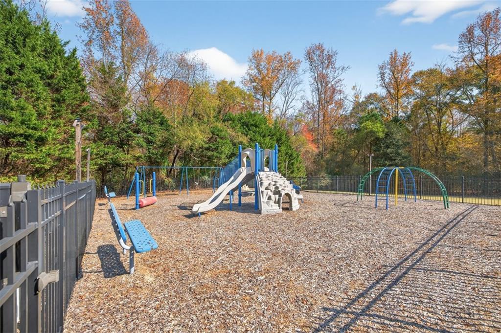 5683 Riverside Walk Drive Northeast Sugar Hill, GA 30518 - Photo 40 of 42 a view of a park with slide