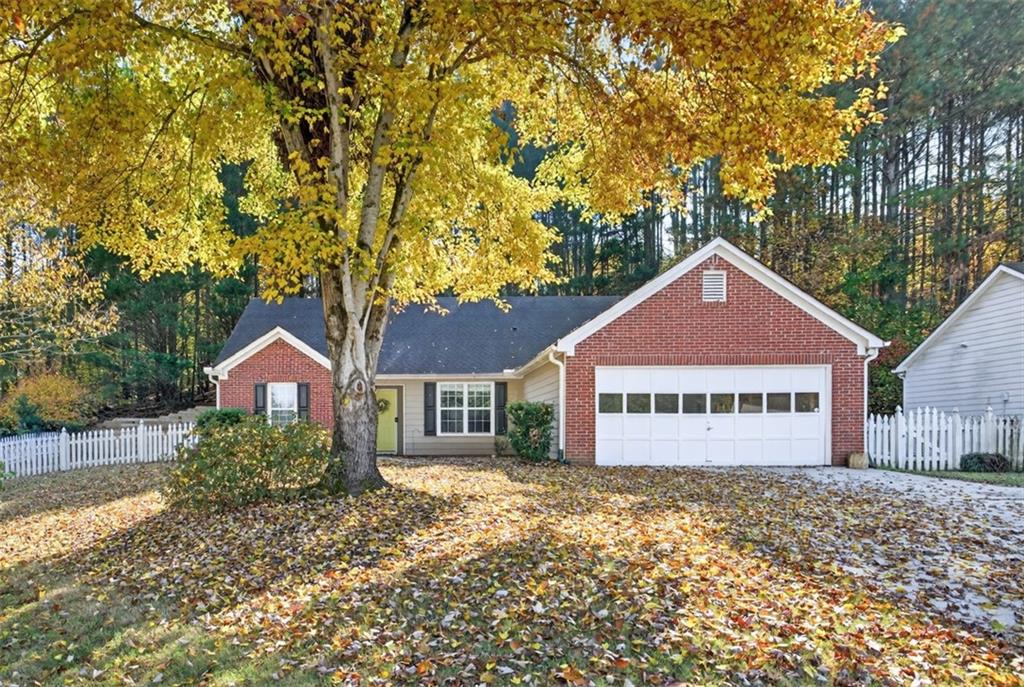 5683 Riverside Walk Drive Northeast Sugar Hill, GA 30518 - Photo 42 of 42 a sign board with a house in the background