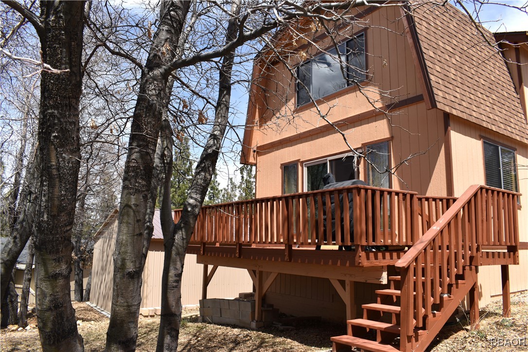 a view of balcony with wooden fencing