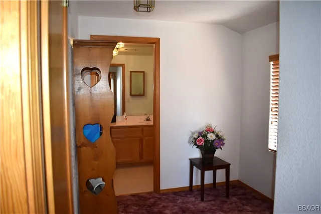 a bedroom with furniture and a window