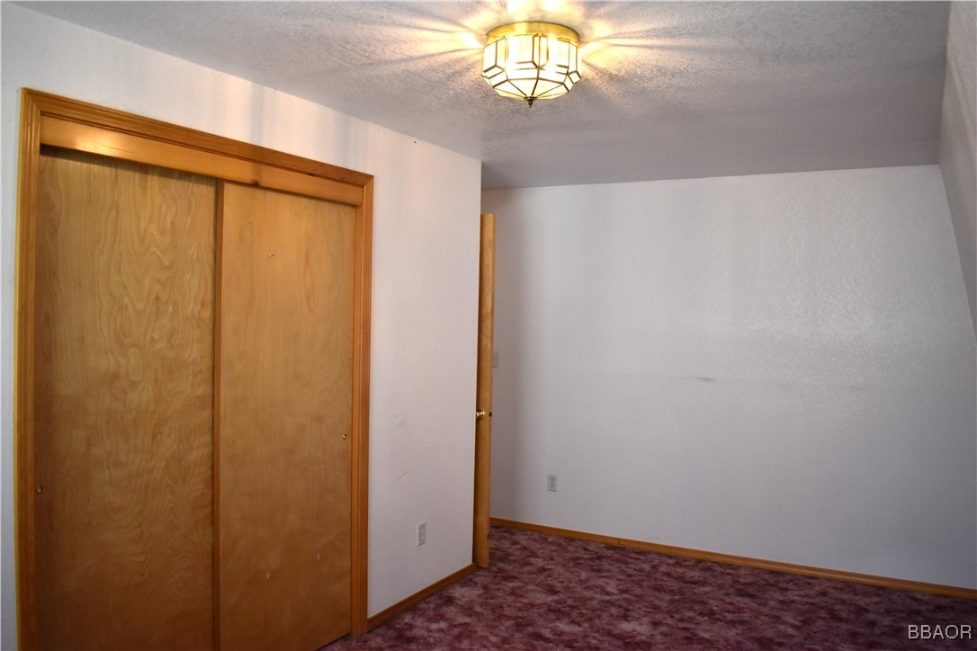 442 Inyo Avenue Sugarloaf, CA 92386 - Photo 23 of 33 a view of an empty room with a window