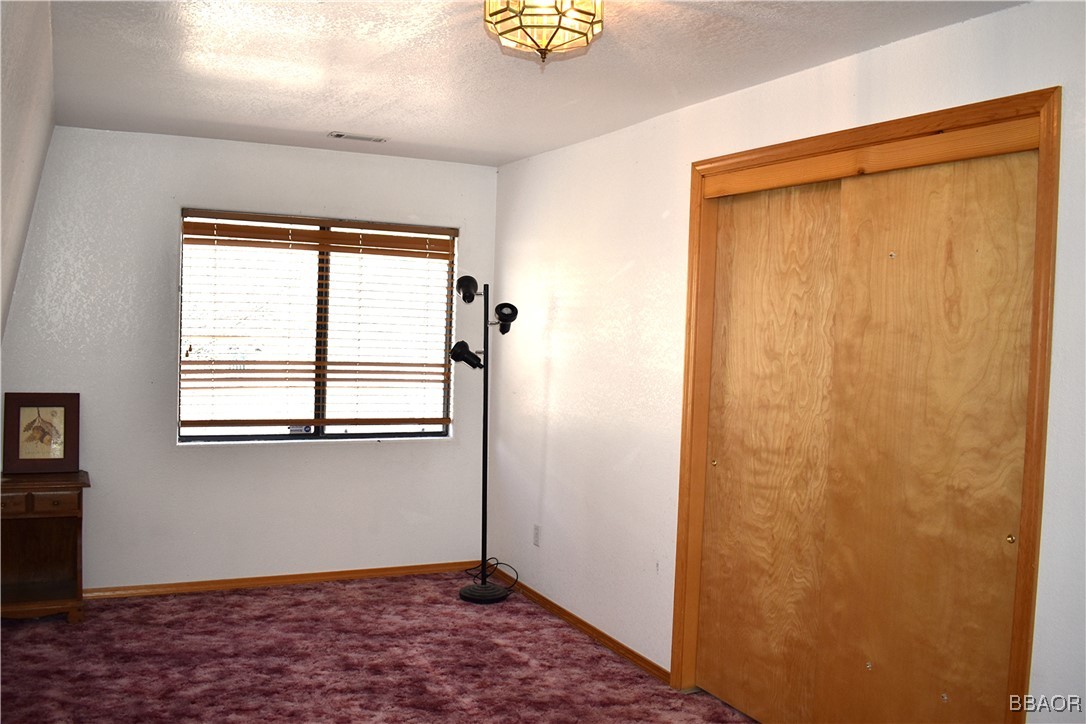 442 Inyo Avenue Sugarloaf, CA 92386 - Photo 24 of 33 a view of an empty room with a window